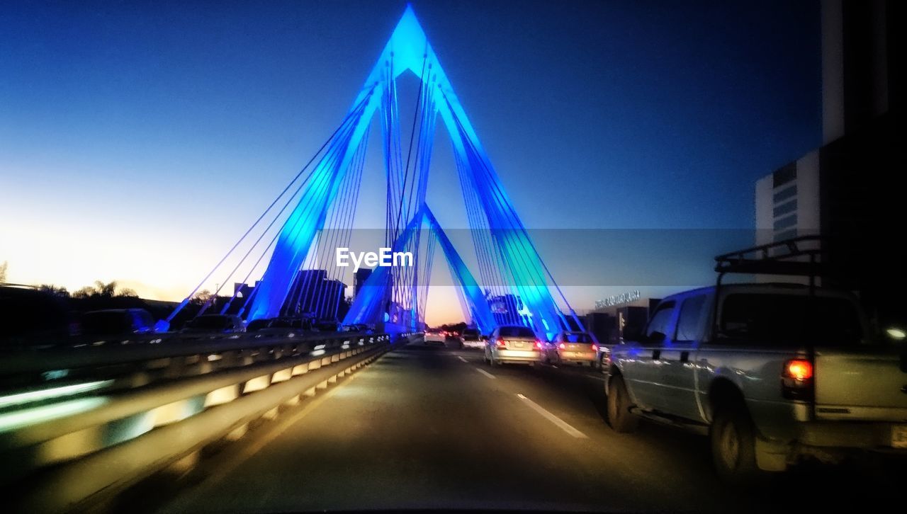 View of suspension bridge at night