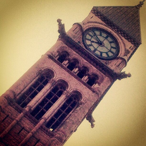 LOW ANGLE VIEW OF CLOCK TOWER AGAINST THE SKY