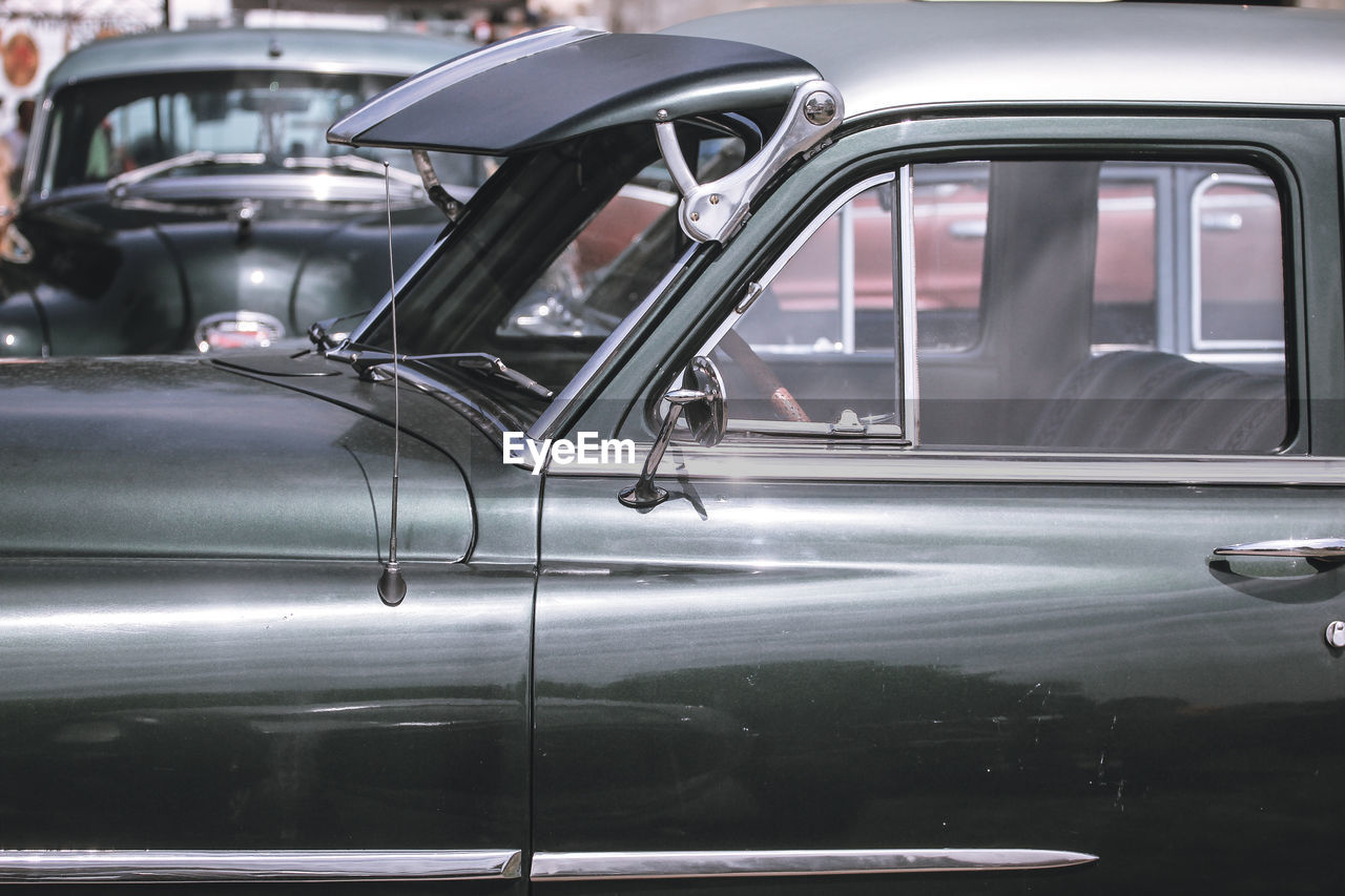 Close-up of classic cars at parking lot