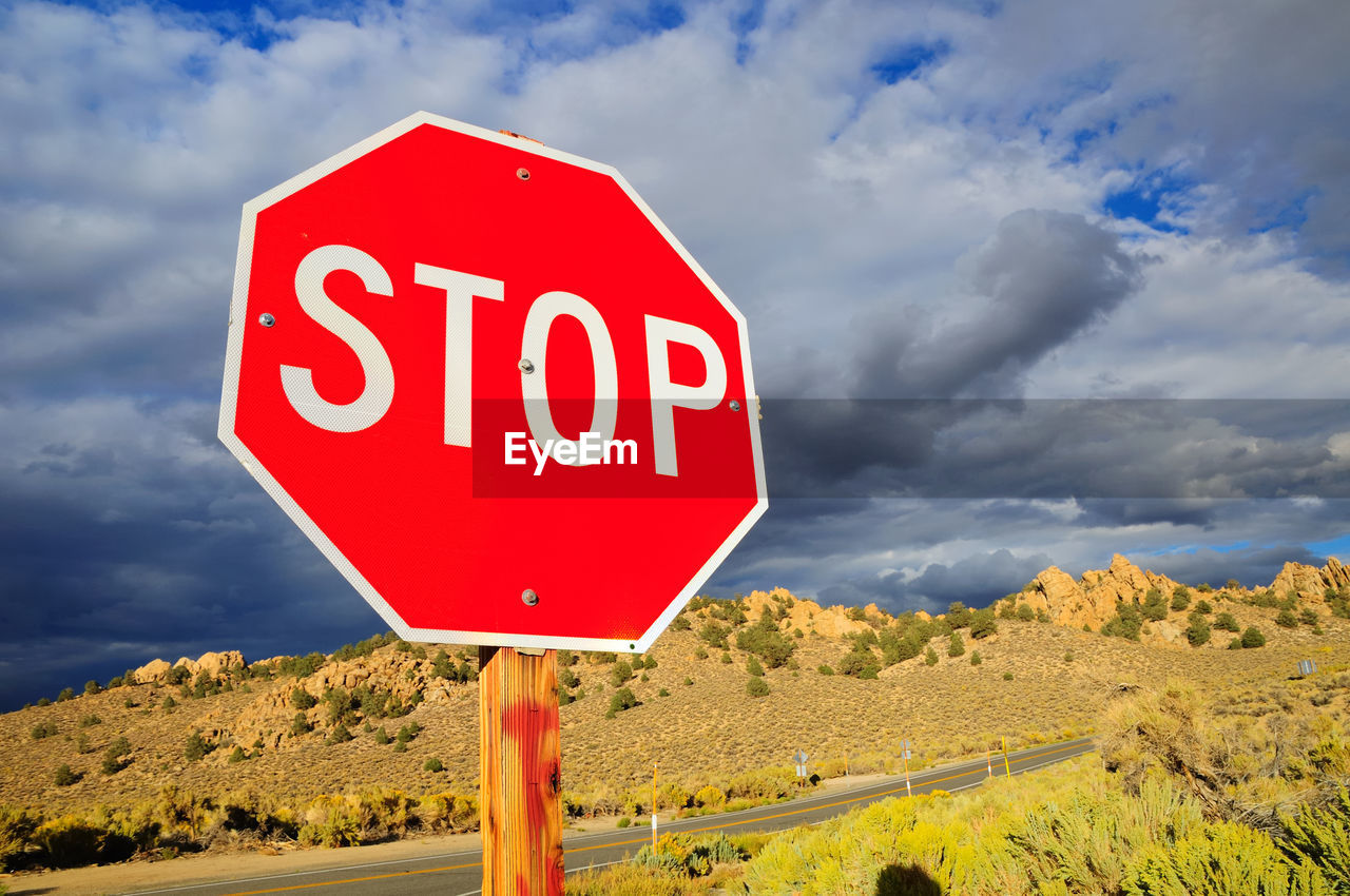 Stop sign against sky