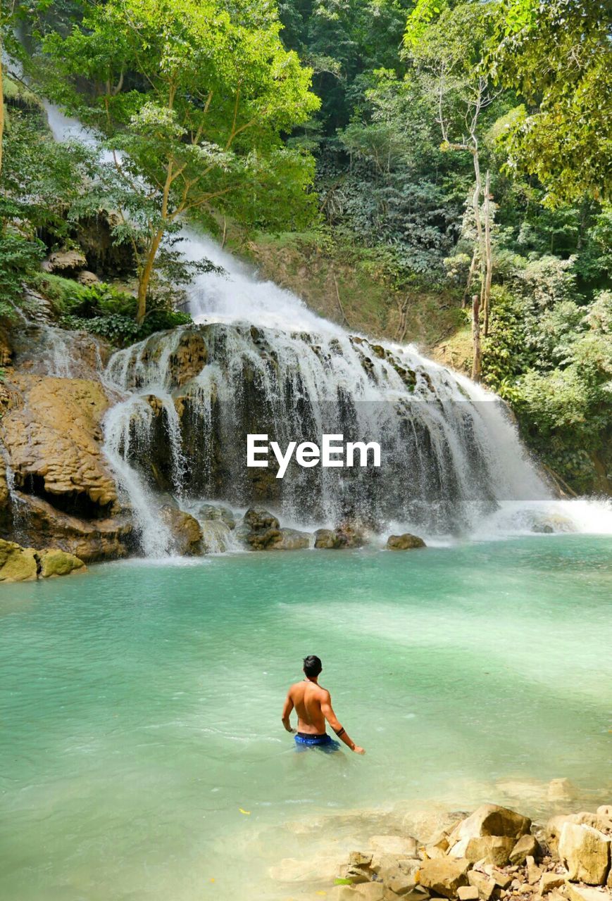 A man see waterfall at sumba island east nusa indonesia