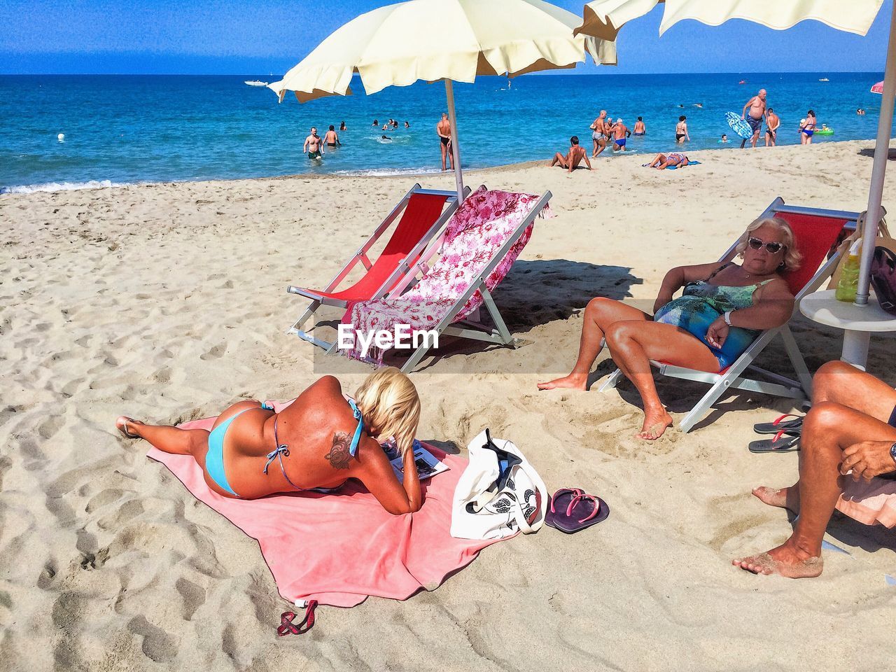 WOMAN RELAXING ON BEACH