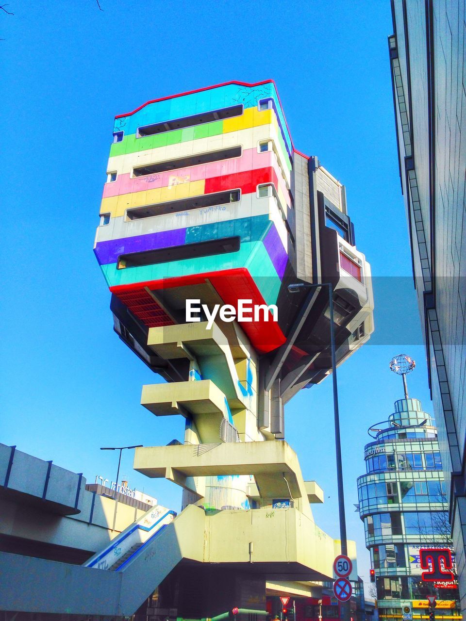 LOW ANGLE VIEW OF BUILDING AGAINST BLUE SKY