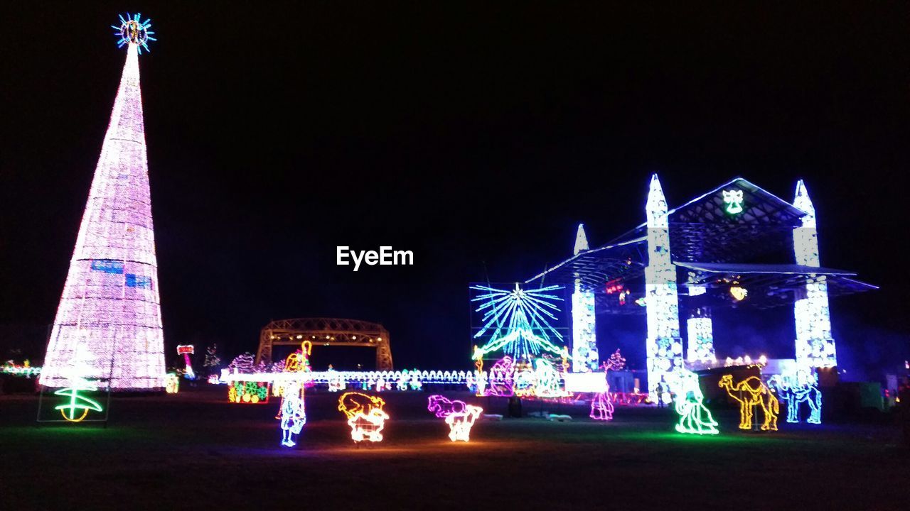 VIEW OF ILLUMINATED BUILDING AT NIGHT