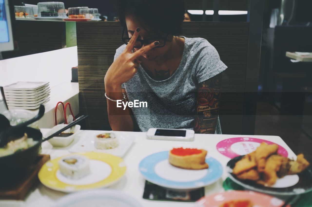 WOMAN HAVING FOOD IN RESTAURANT