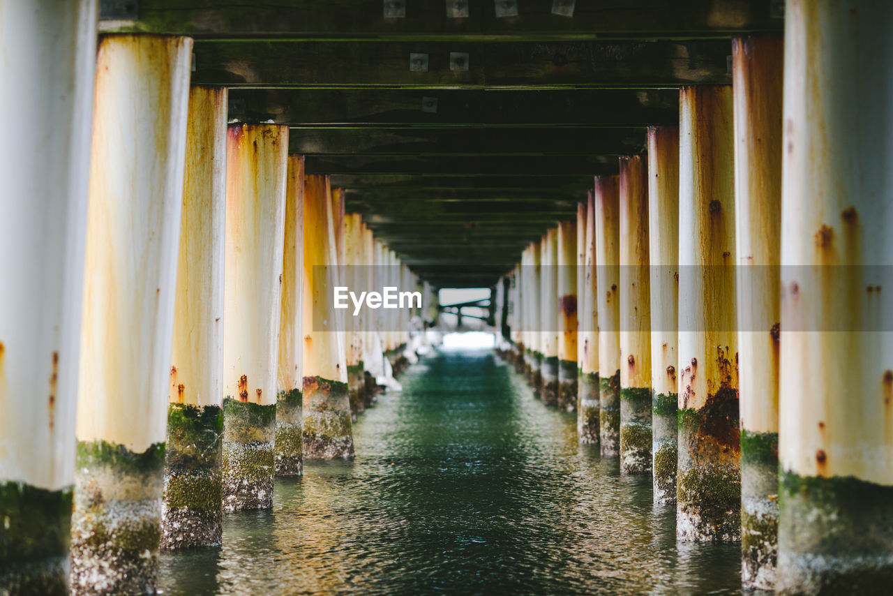 Corridor of water under pier