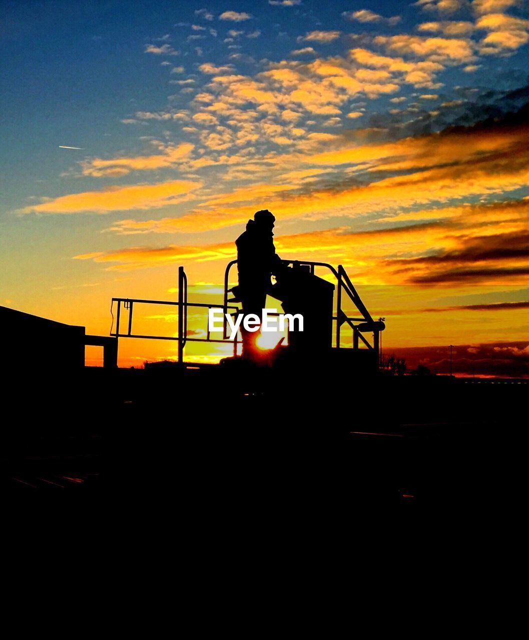 SILHOUETTE PEOPLE ON LANDSCAPE AT SUNSET