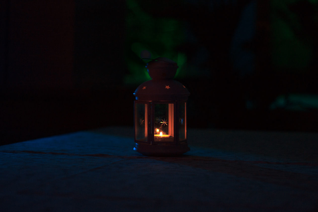 CLOSE-UP OF ILLUMINATED TABLE