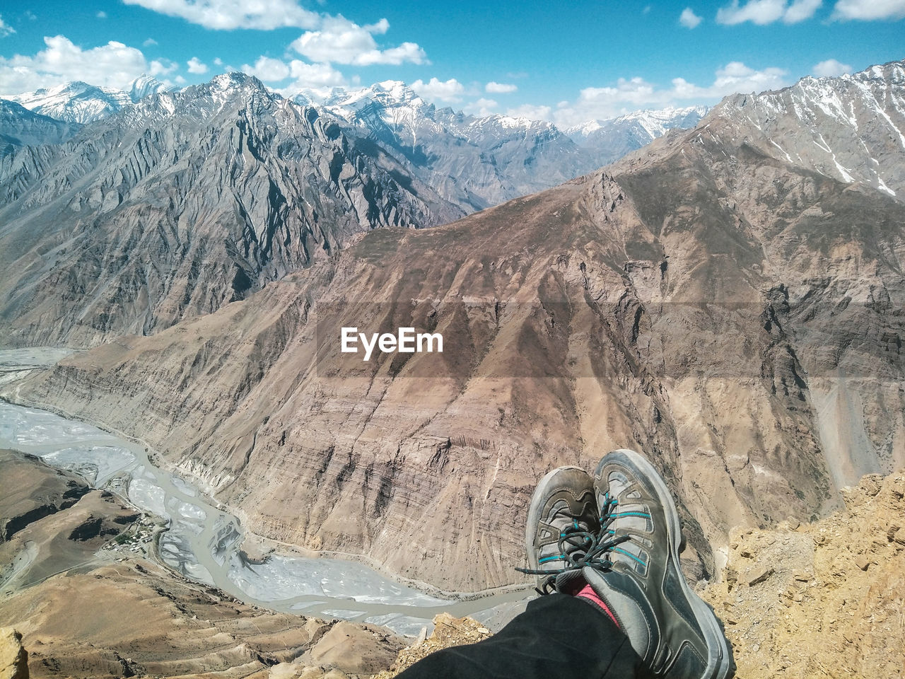 Low section of person against mountains