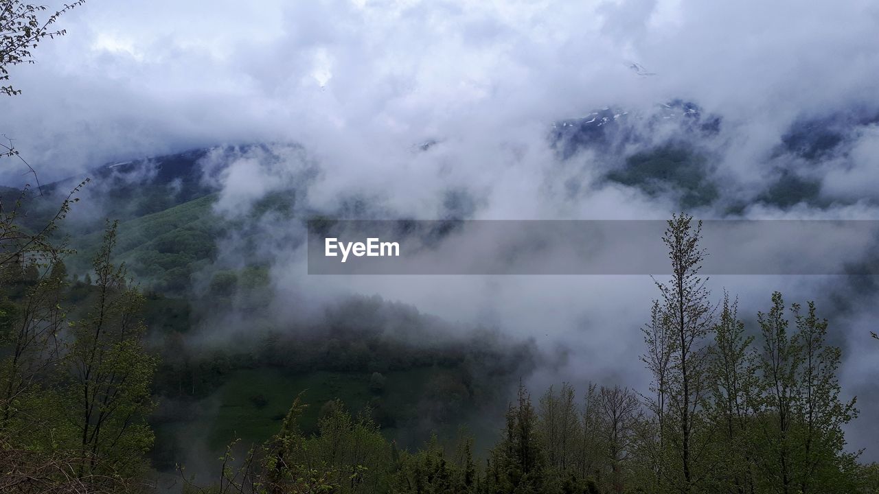 Scenic view of fog against sky