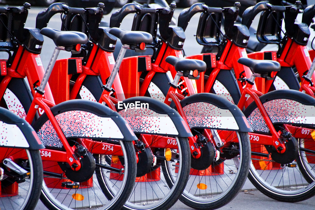 Red bicycles parked in row