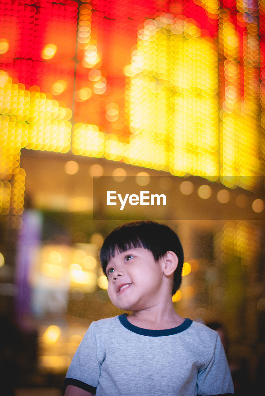 Cute smiling boy at amusement park