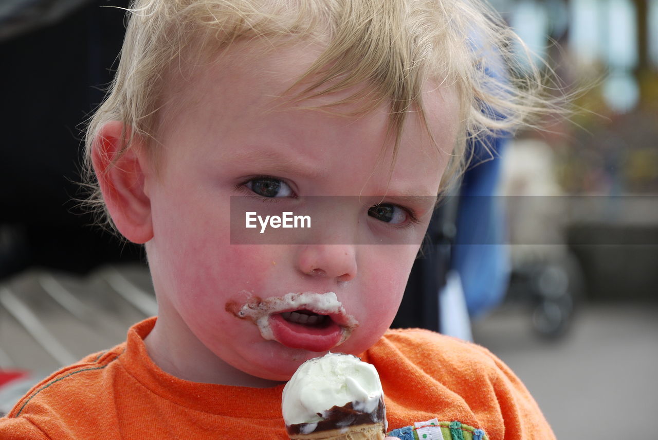 Close-up of cute boy eating ice cream