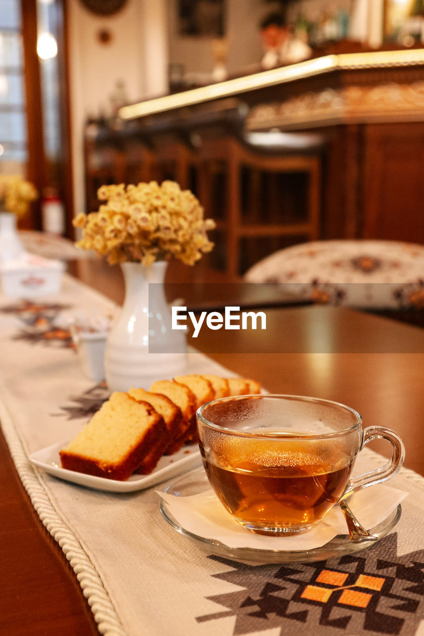 CLOSE-UP OF COFFEE SERVED ON TABLE IN GLASS