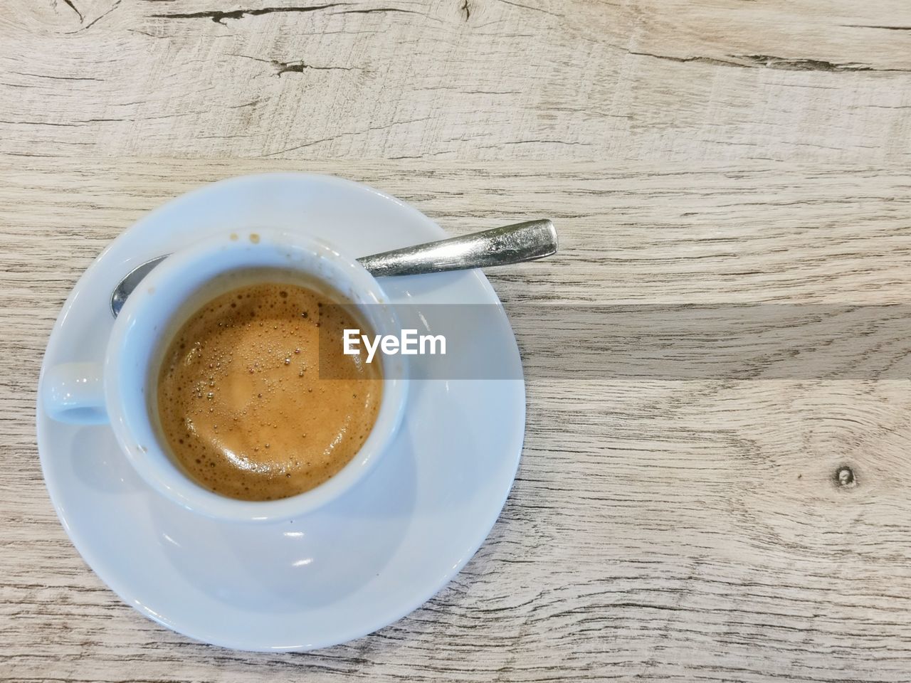 High angle view of coffee cup on table