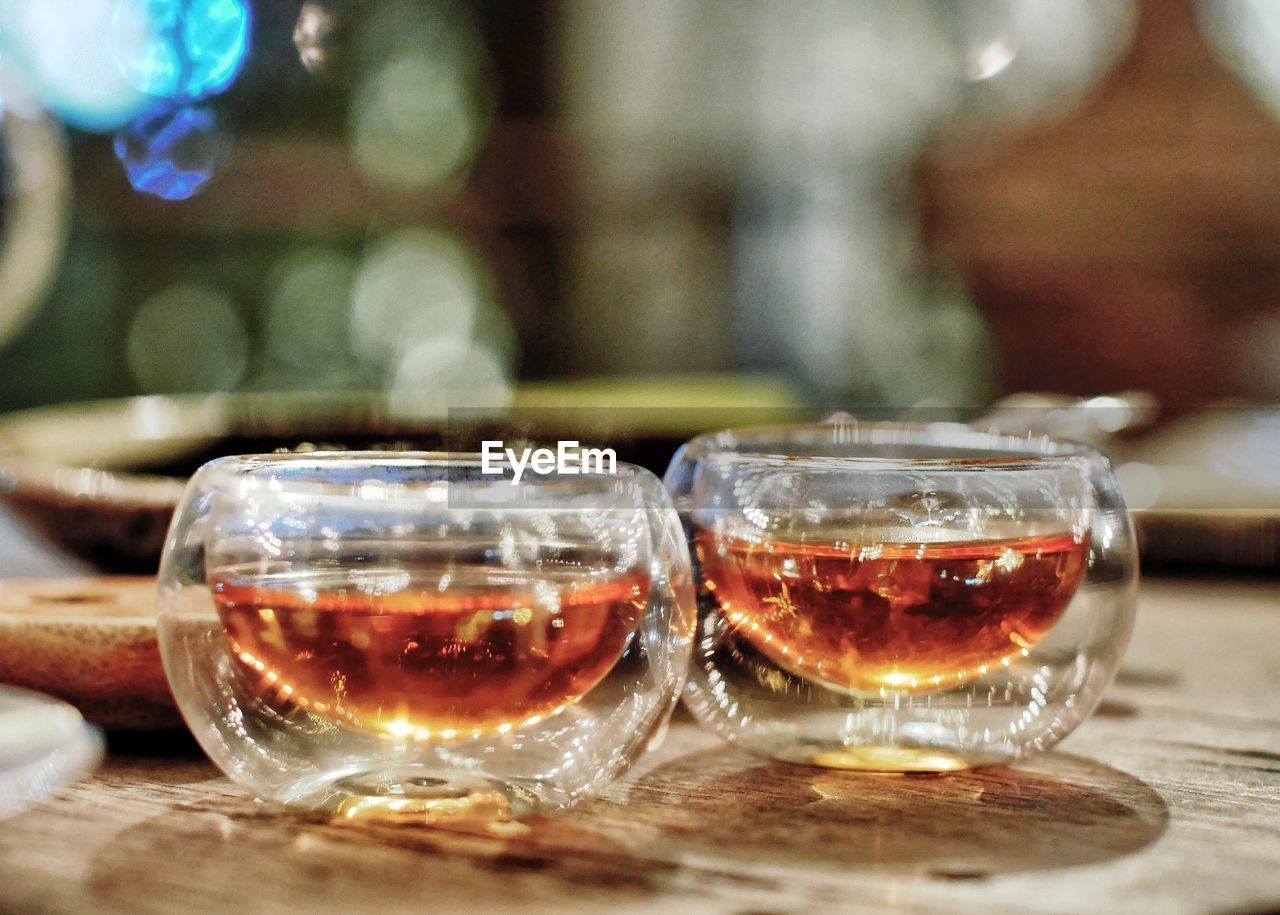 Close-up of tea glass on table
