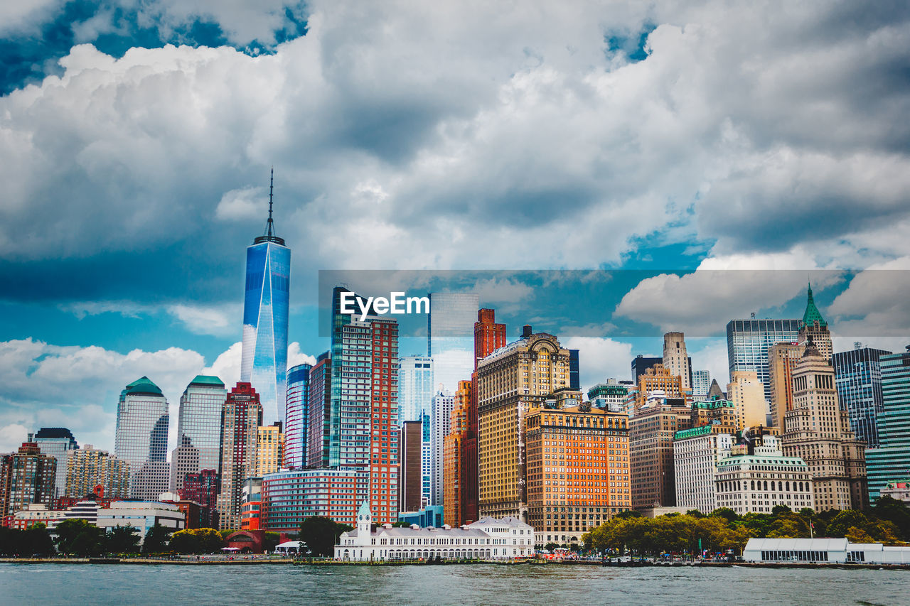 City skyline against cloudy sky