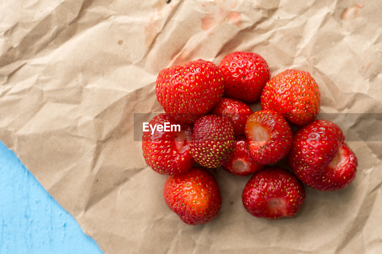 Close-up of strawberries on paper