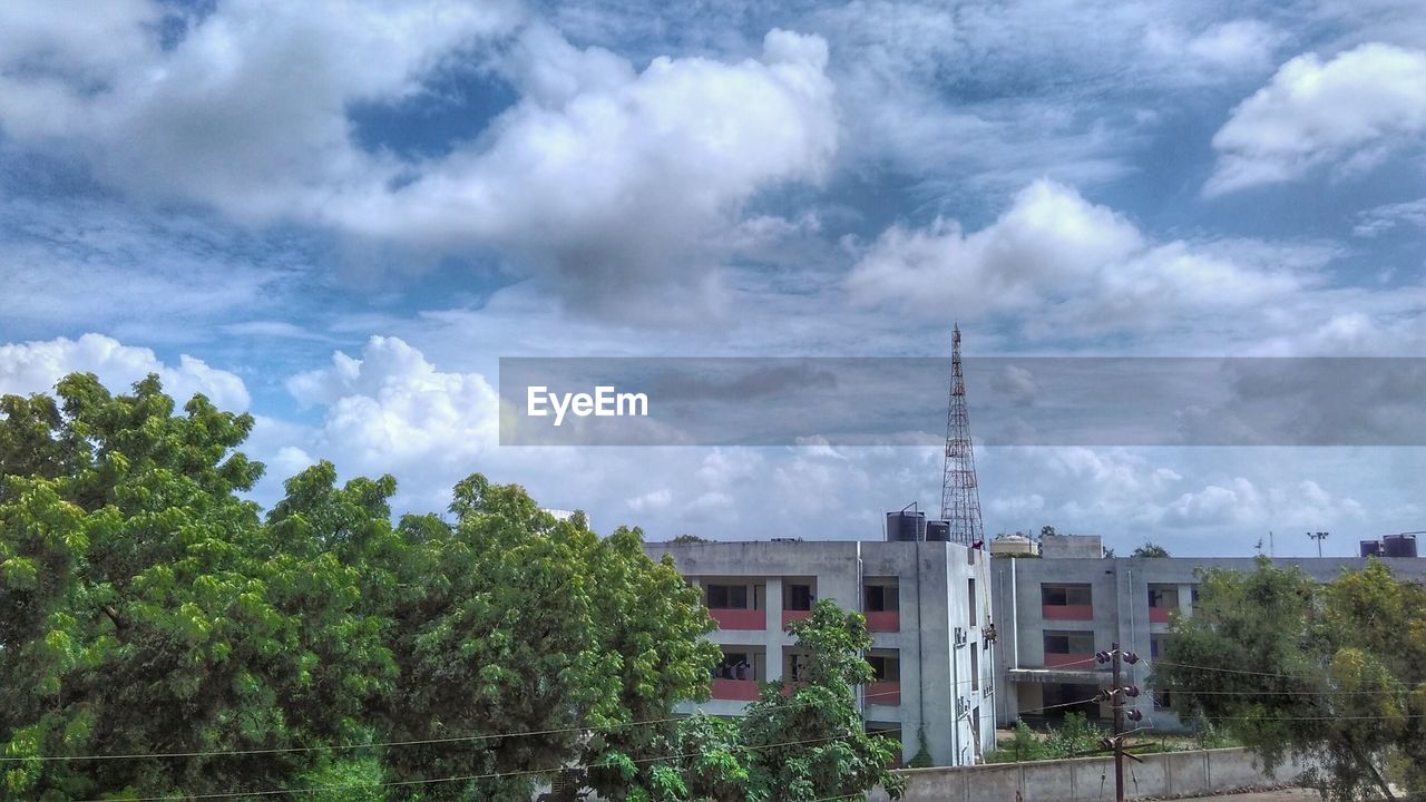 CLOUDY SKY ABOVE BUILDINGS