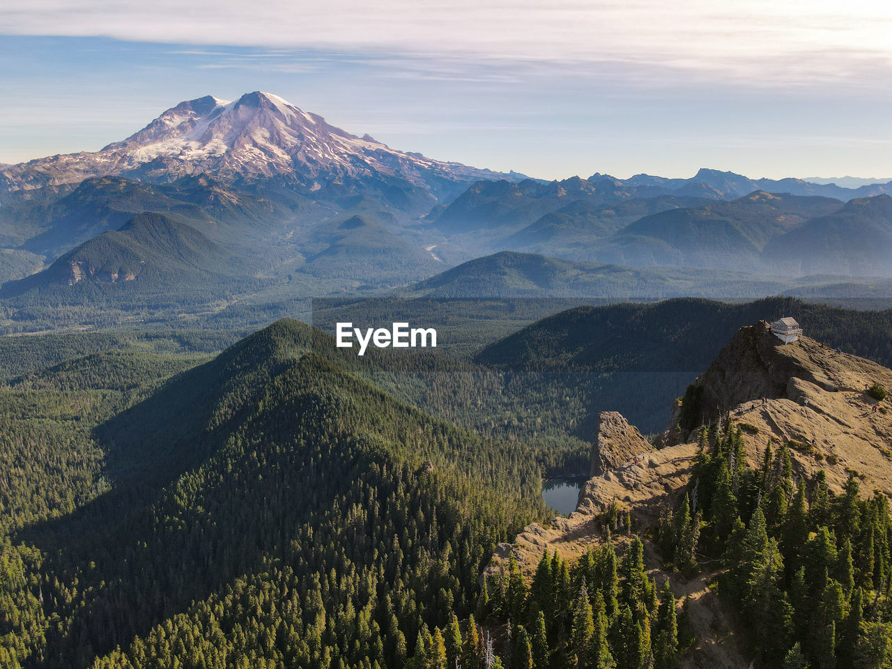 Scenic view of mountains against cloudy sky