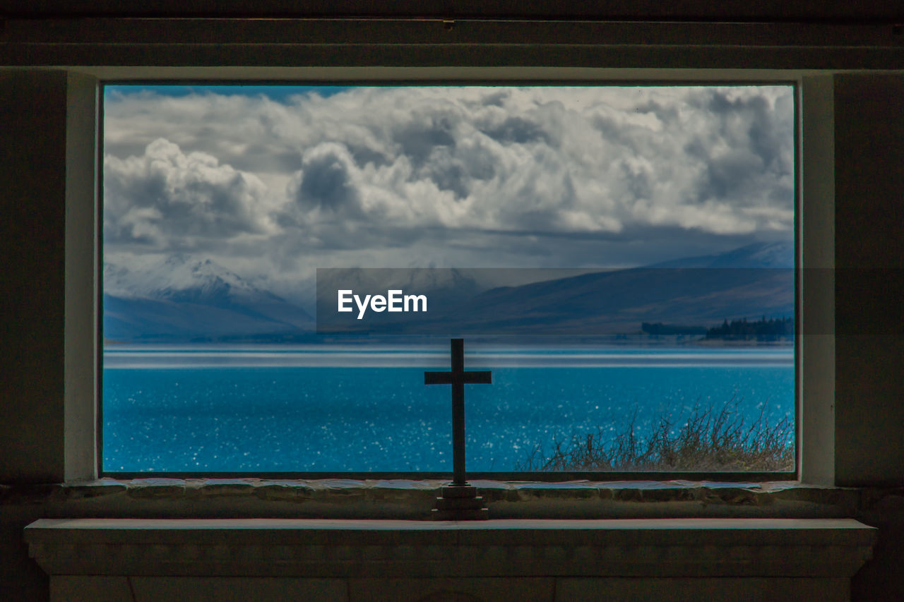 SCENIC VIEW OF SEA AGAINST SKY SEEN FROM ARCH