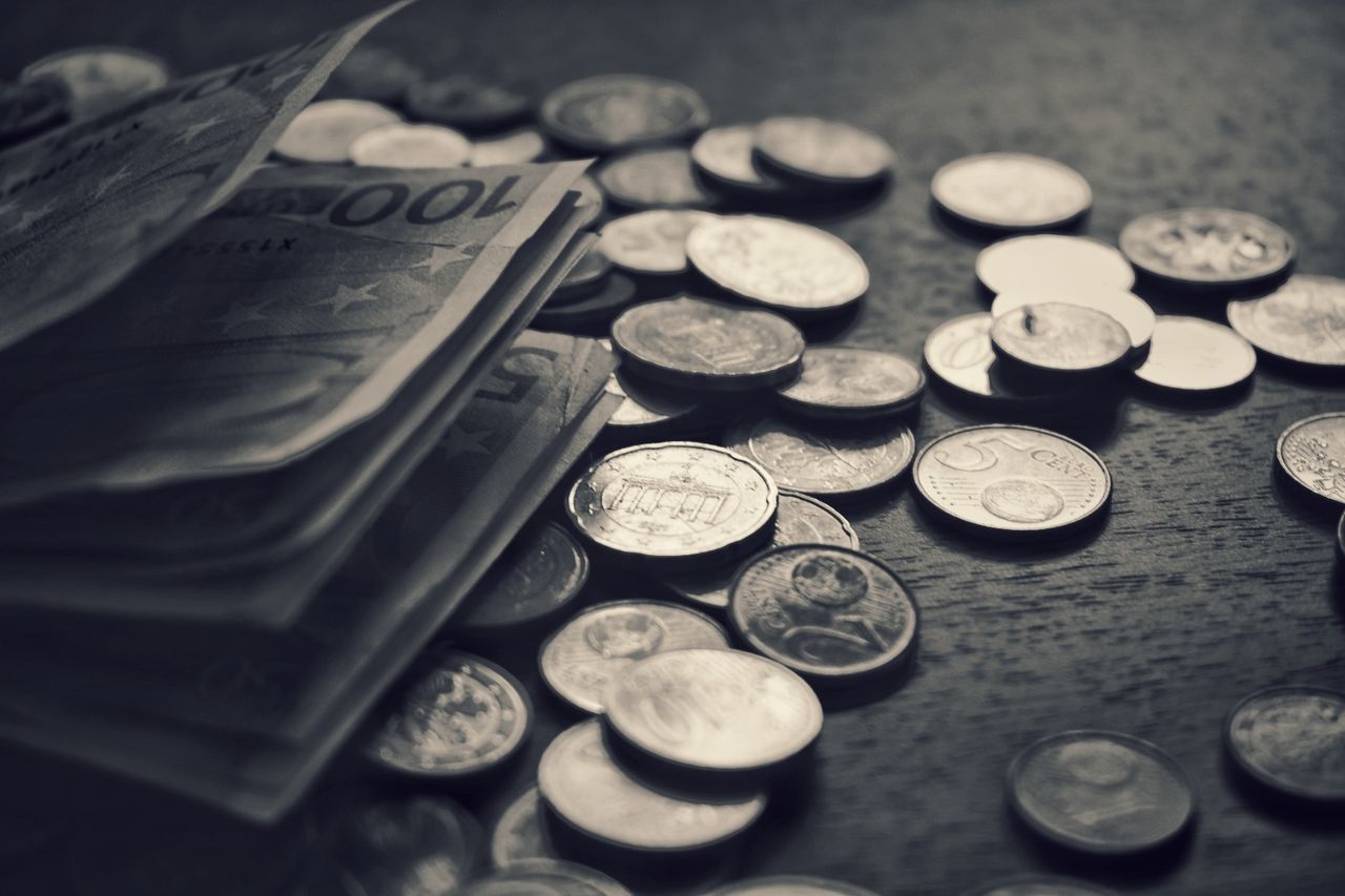 CLOSE-UP HIGH ANGLE VIEW OF COINS