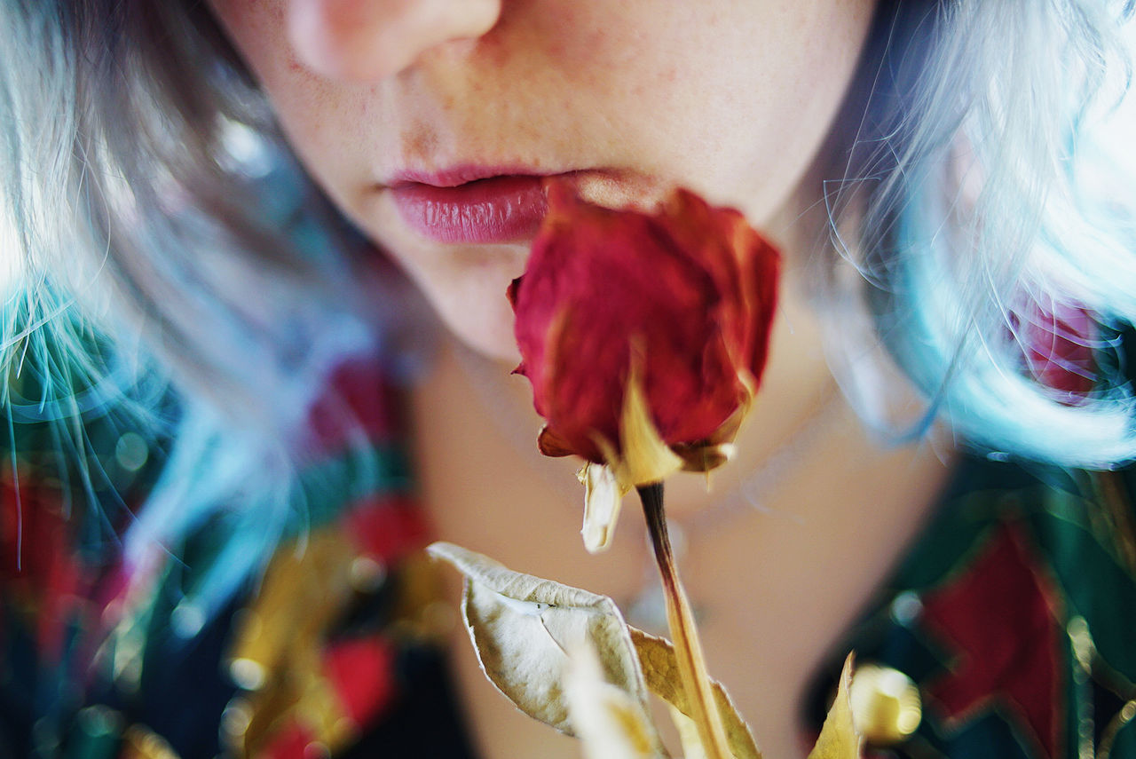 WOMAN WITH RED FLOWERS