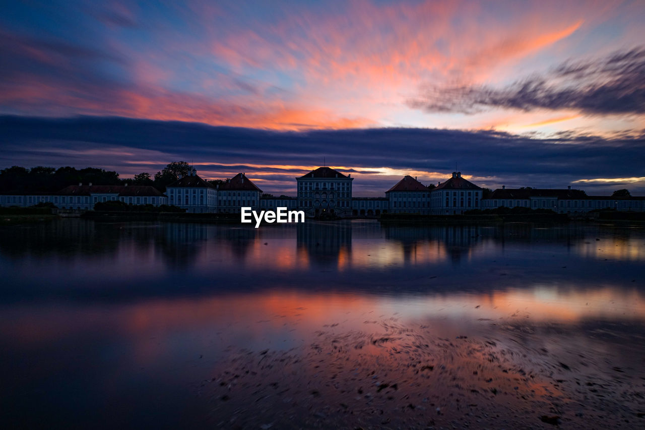 Scenic view of lake against orange sky