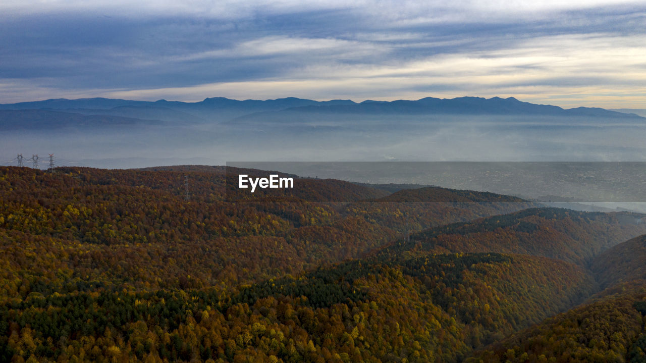 SCENIC VIEW OF LAND AND MOUNTAINS AGAINST SKY