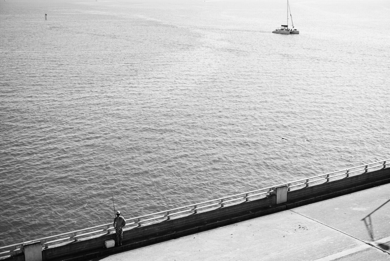 High angle view of bridge by sea on sunny day