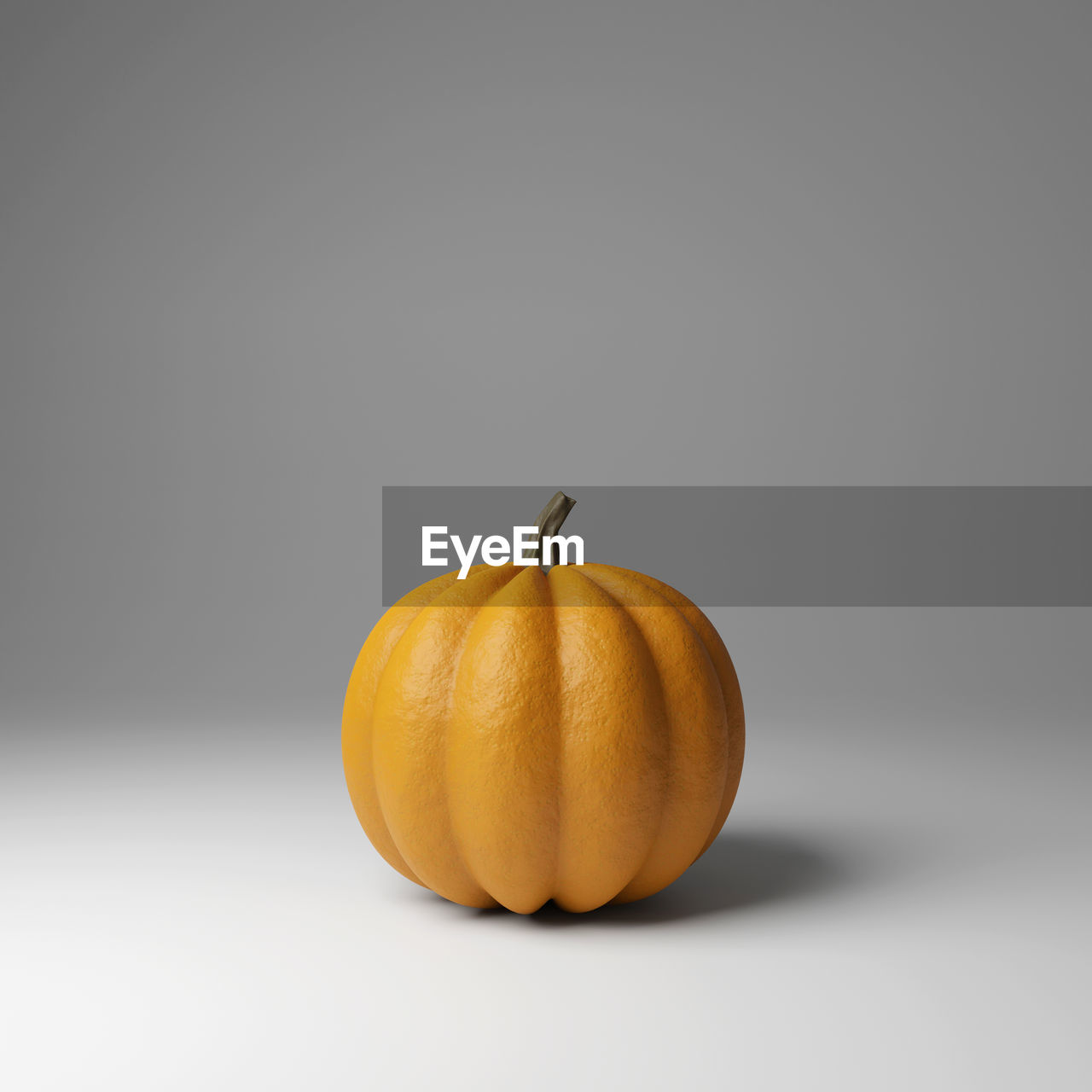 CLOSE-UP OF PUMPKINS AGAINST ORANGE BACKGROUND