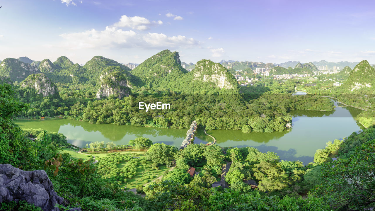 Scenic view of mountain and lake against sky