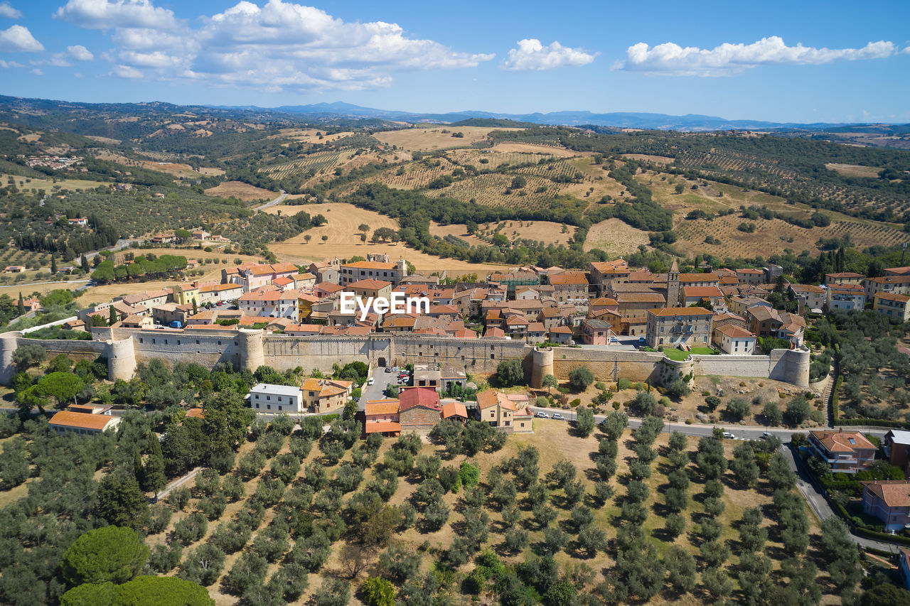 Zoomed aerial view of the medieval town of magliano in tuscany