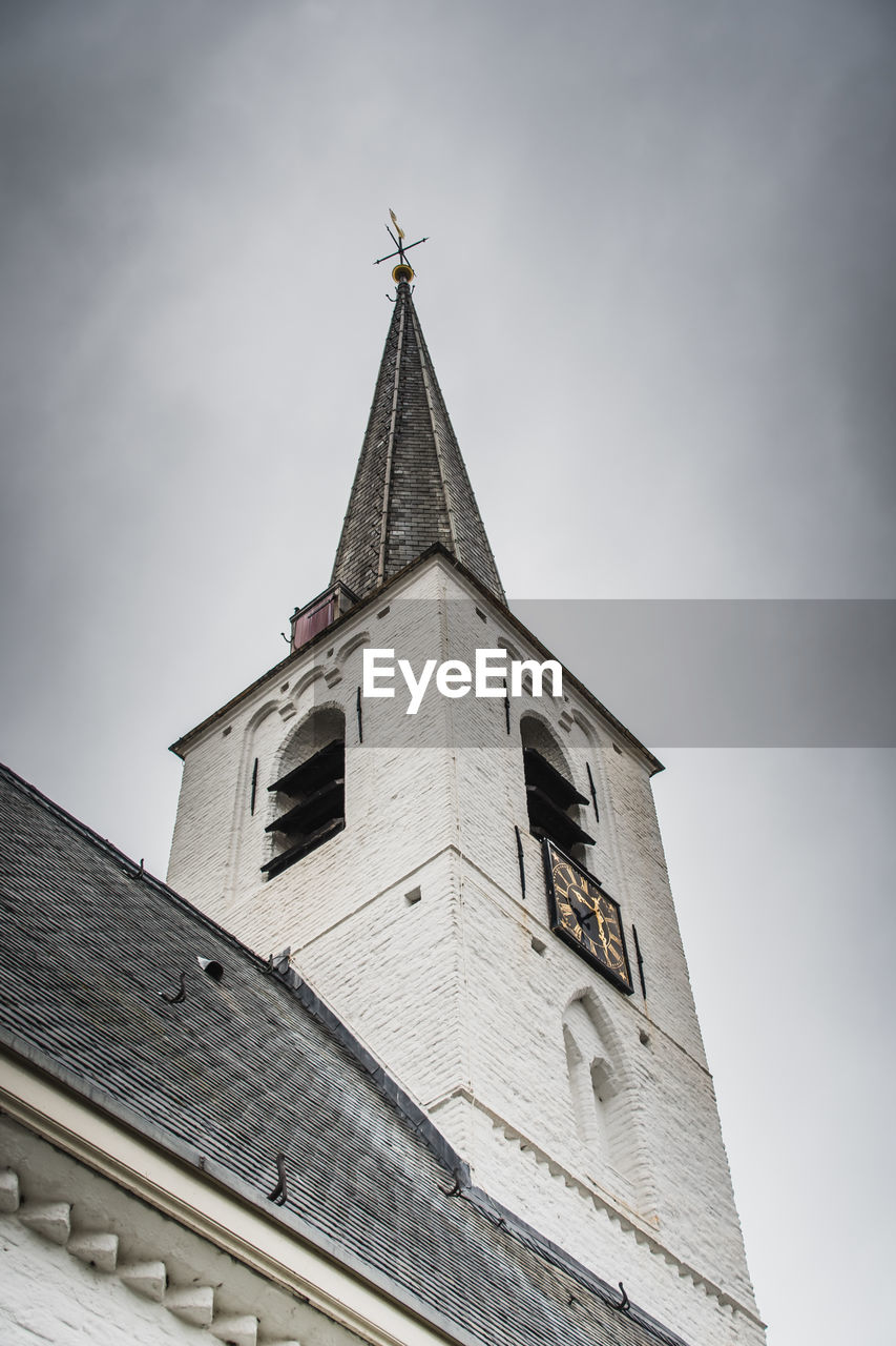 LOW ANGLE VIEW OF CHURCH AGAINST BUILDING