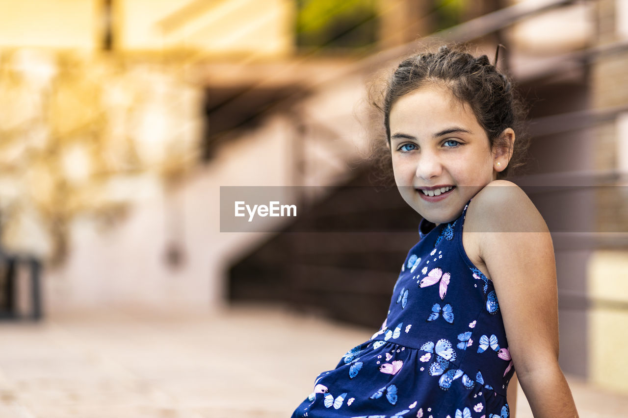 Beautiful little girl with blue dress