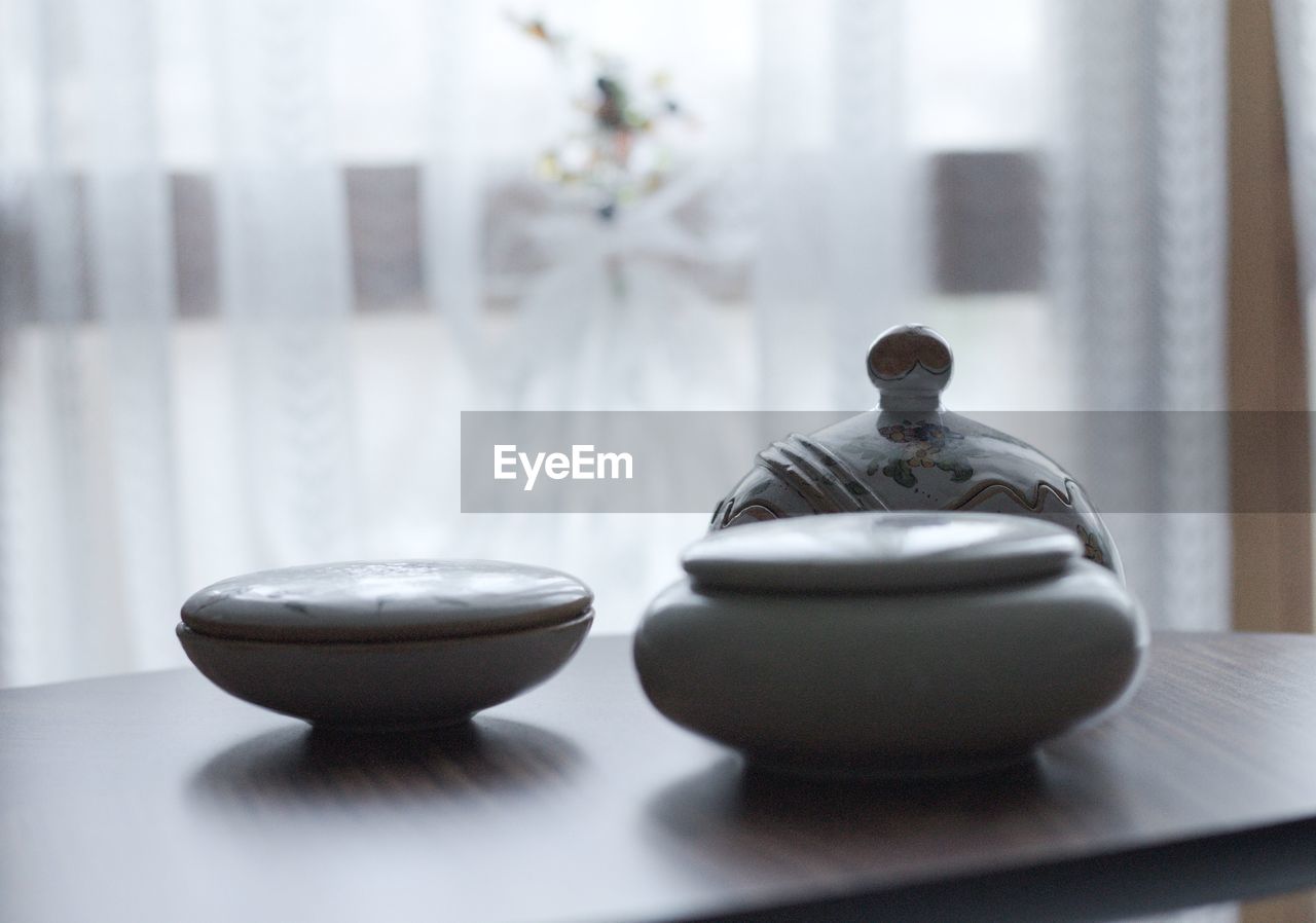 Close-up of crockery on table