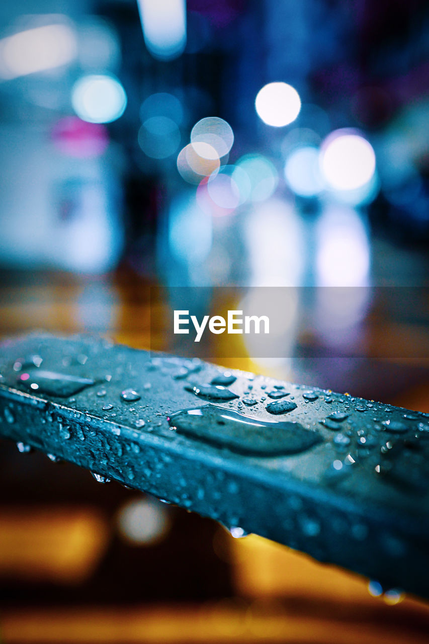 Close-up of raindrops on table