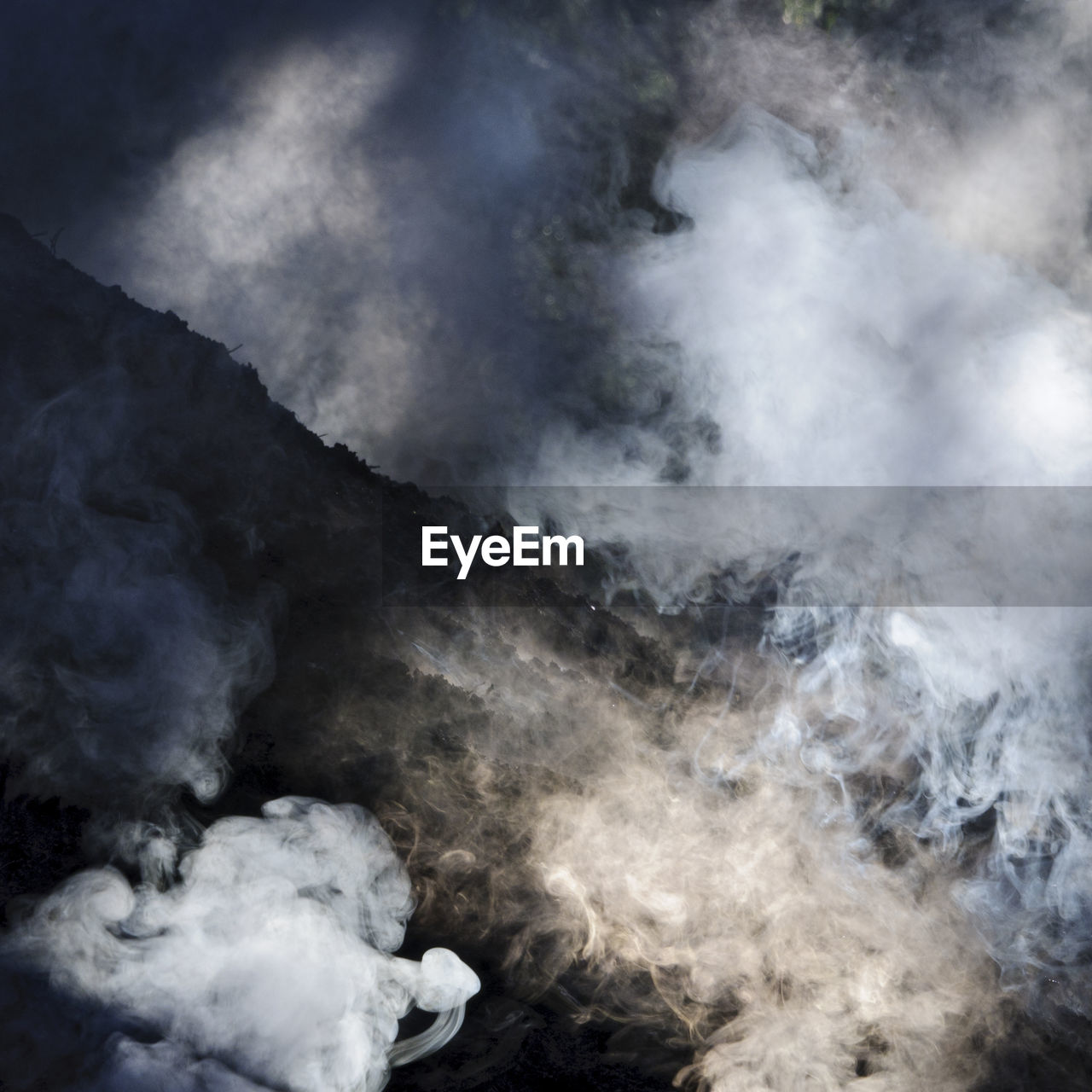 Smoke from charcoal pile, hunneberg, sweden, europe