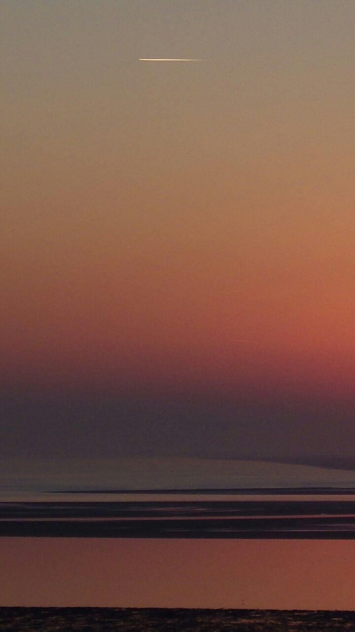 SCENIC VIEW OF SEA DURING SUNSET