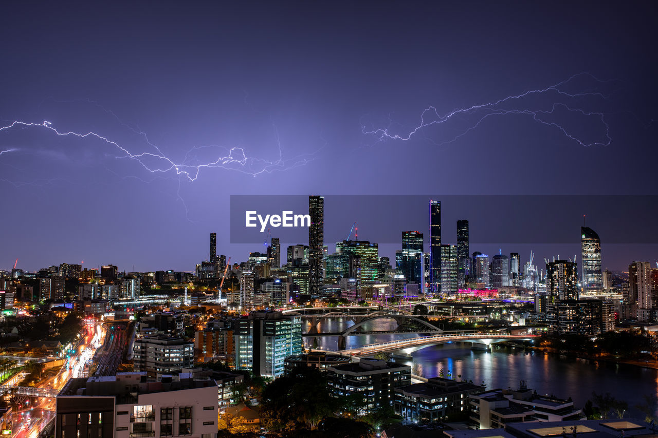 Lightning over buildings in city at night