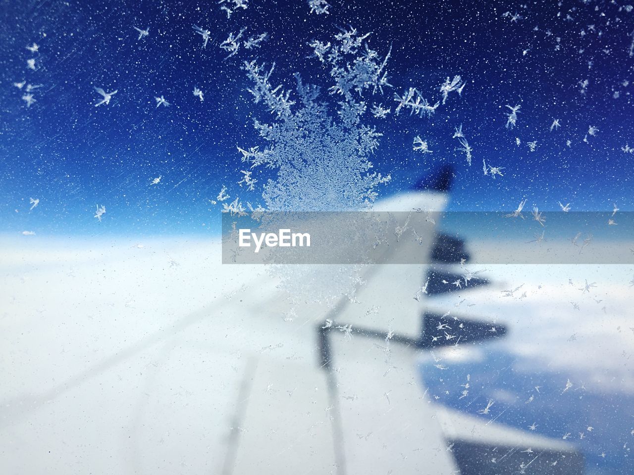 Ice crystals on airplane window