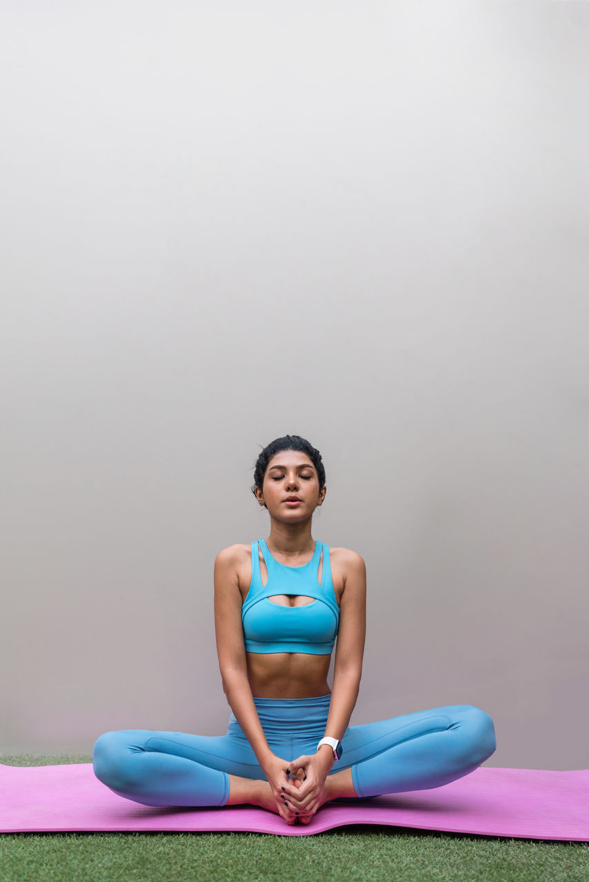 Young woman meditating outdoors