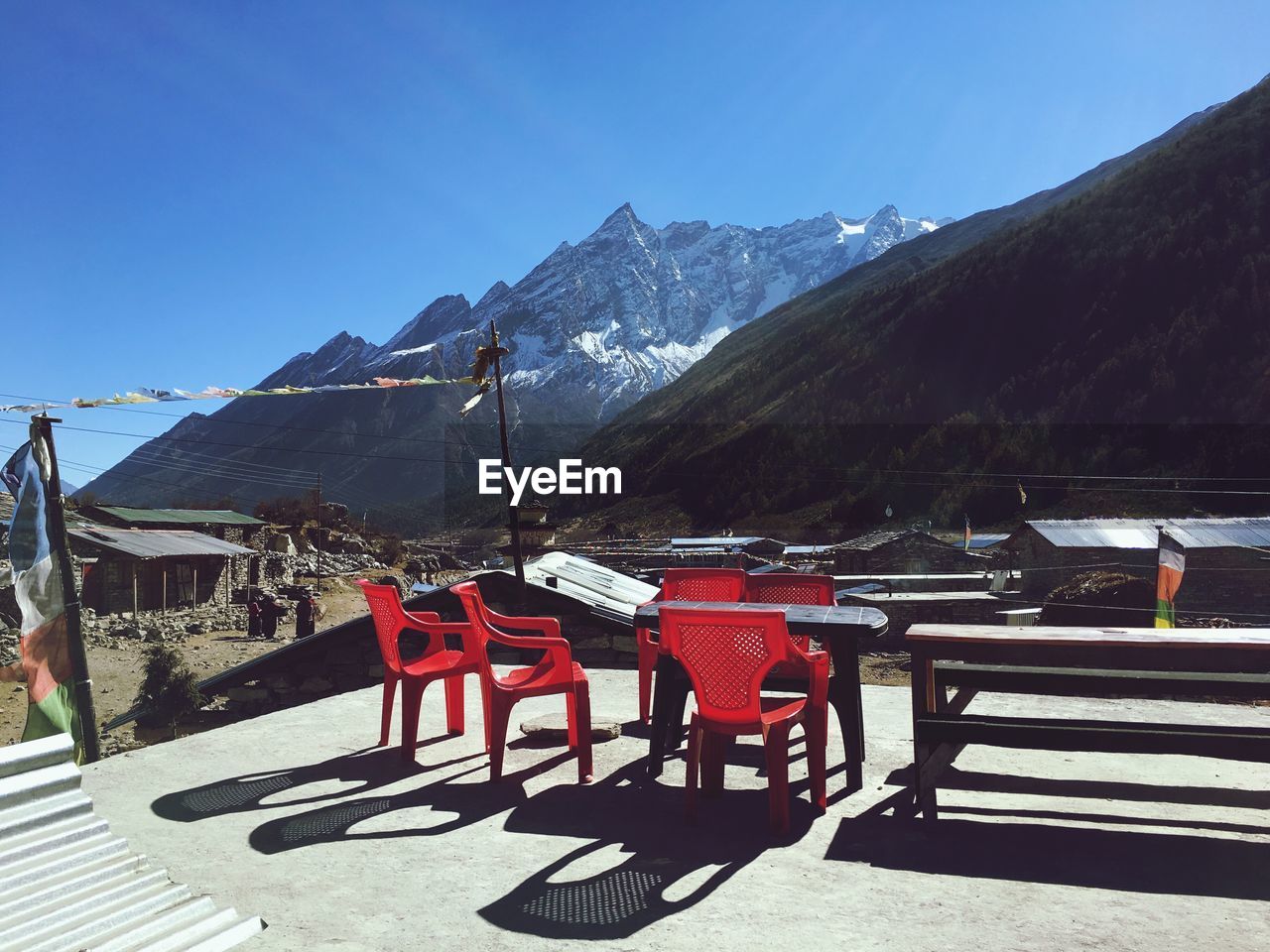 VIEW OF CHAIRS ON SUNNY DAY