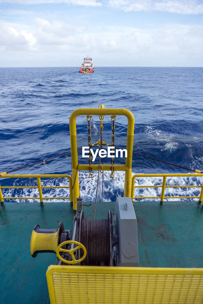 A tugboat towing a construction work barge at offshore terengganu oil field