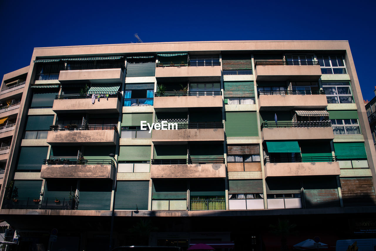 Low angle view of residential building against clear sky