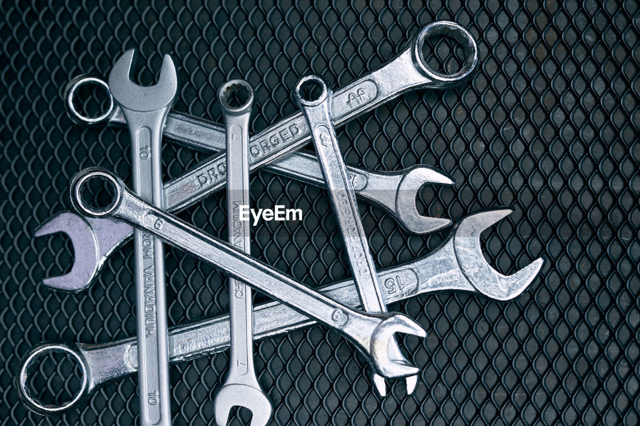 Set of chrome wrenches on steel surface. mechanic tools for maintenance. hardware tools to fix. tech