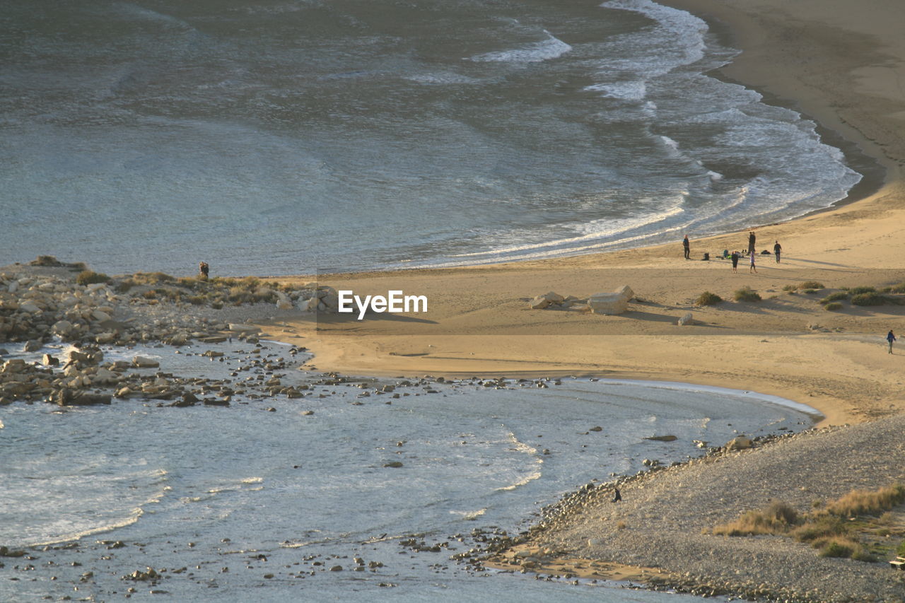 land, water, sand, shore, beach, sea, coast, nature, beauty in nature, scenics - nature, environment, wave, landscape, day, natural environment, high angle view, tranquility, non-urban scene, tranquil scene, outdoors, no people, geology, travel, ocean, travel destinations, tourism, body of water