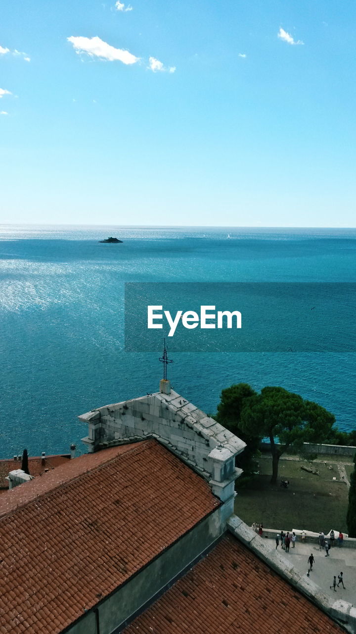 High angle view of building by sea against sky