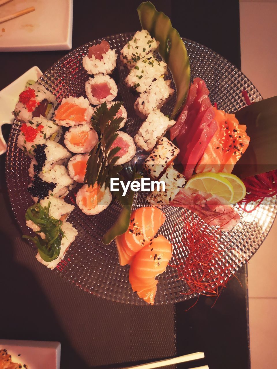 CLOSE-UP OF SUSHI IN PLATE ON TABLE