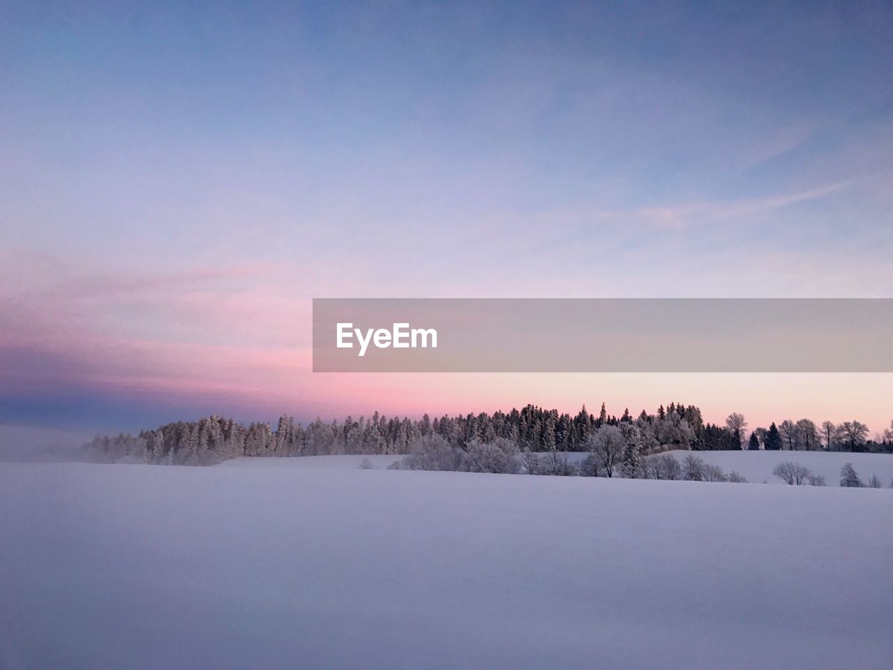 Scenic view of landscape against sky during sunset